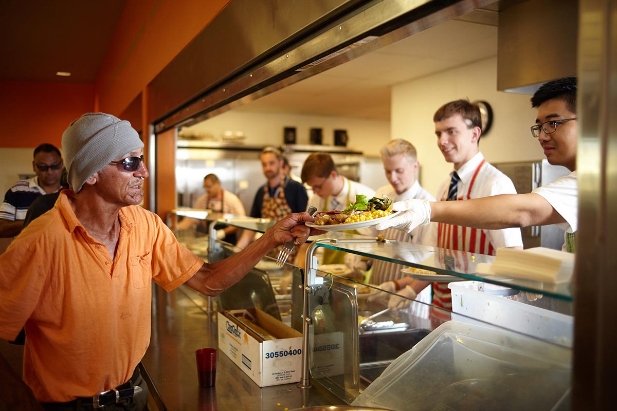 Person receiving a hot meal at CVRM