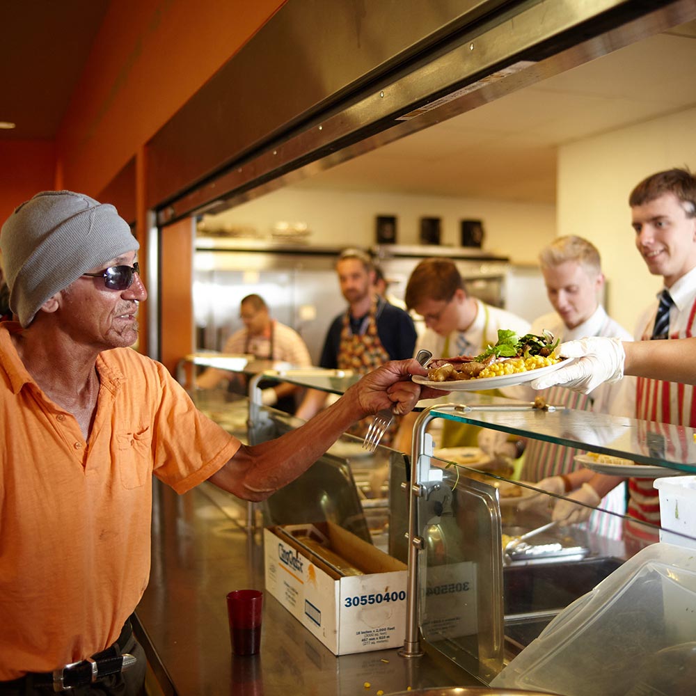 Person receiving a hot meal at CVRM