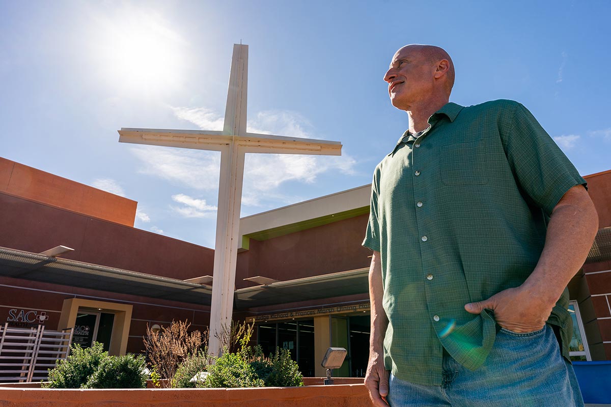 Man standing in front of CVRM facilities